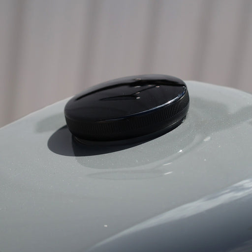 Gloss black gas cap on tank